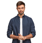 waist-up-portrait-handsome-serious-unshaven-male-keeps-hands-together-dressed-dark-blue-shirt-has-talk-with-interlocutor-stands-against-white-wall-self-confident-man-freelancer